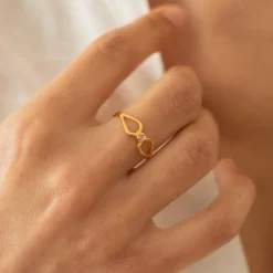 Bague réglable volutes cristal rose doré