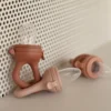 Sucette grignoteuse terre de sienne avec 4 embouts